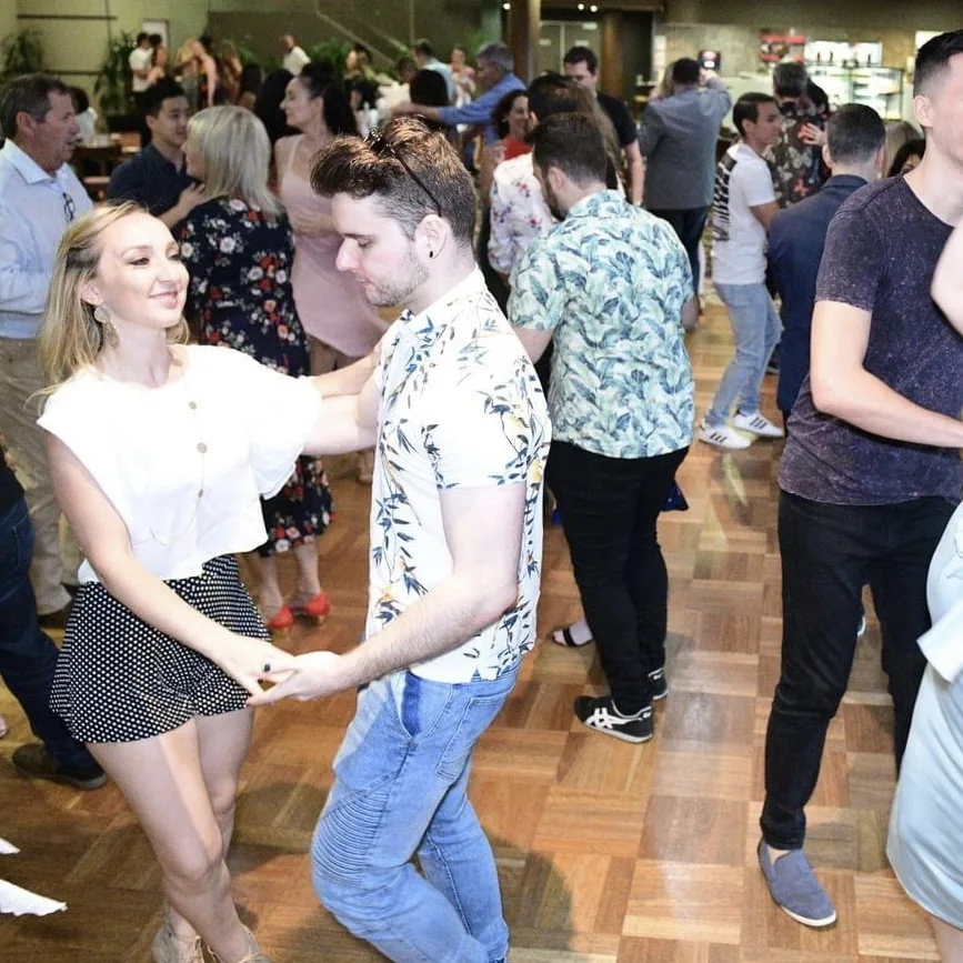 Latin dancers social dancing together