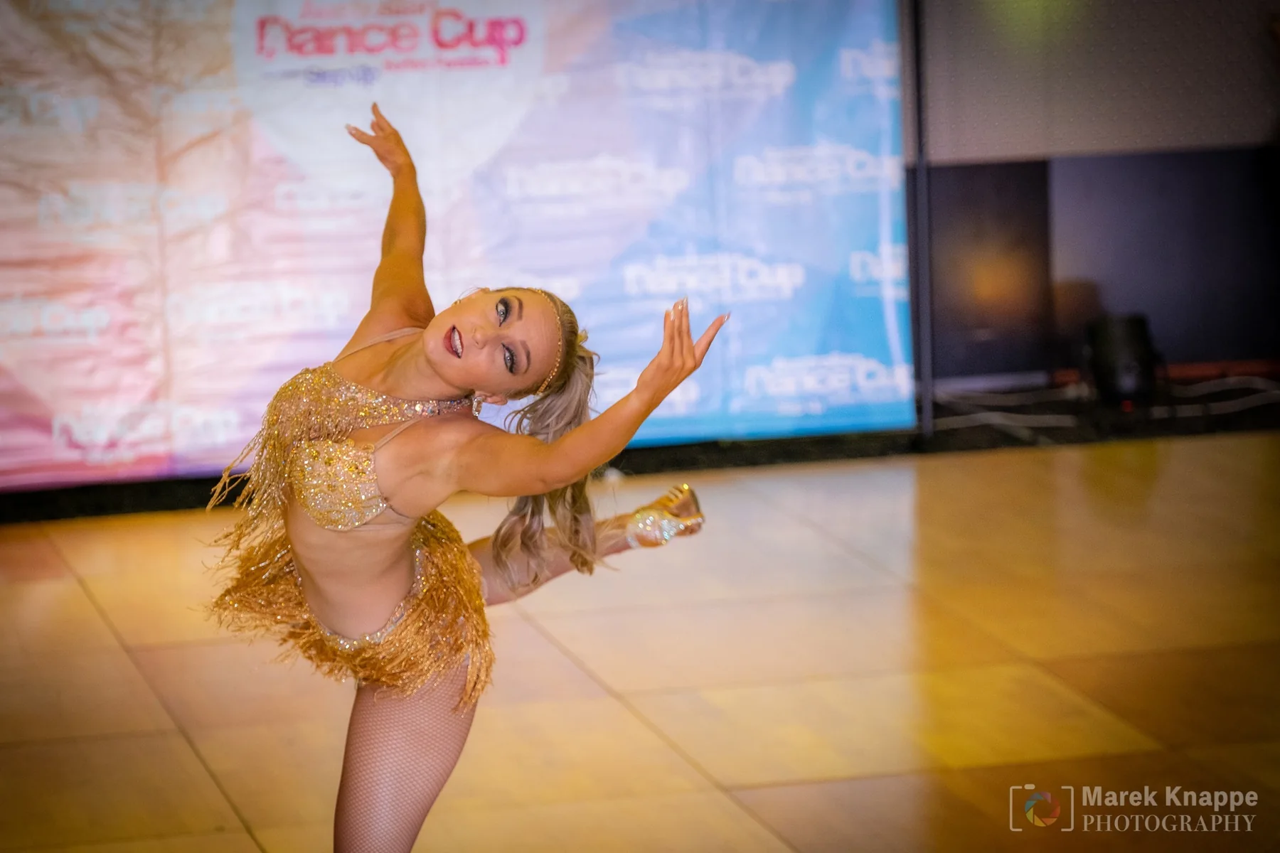 Kristi Hall performing a Latin dance solo in competition