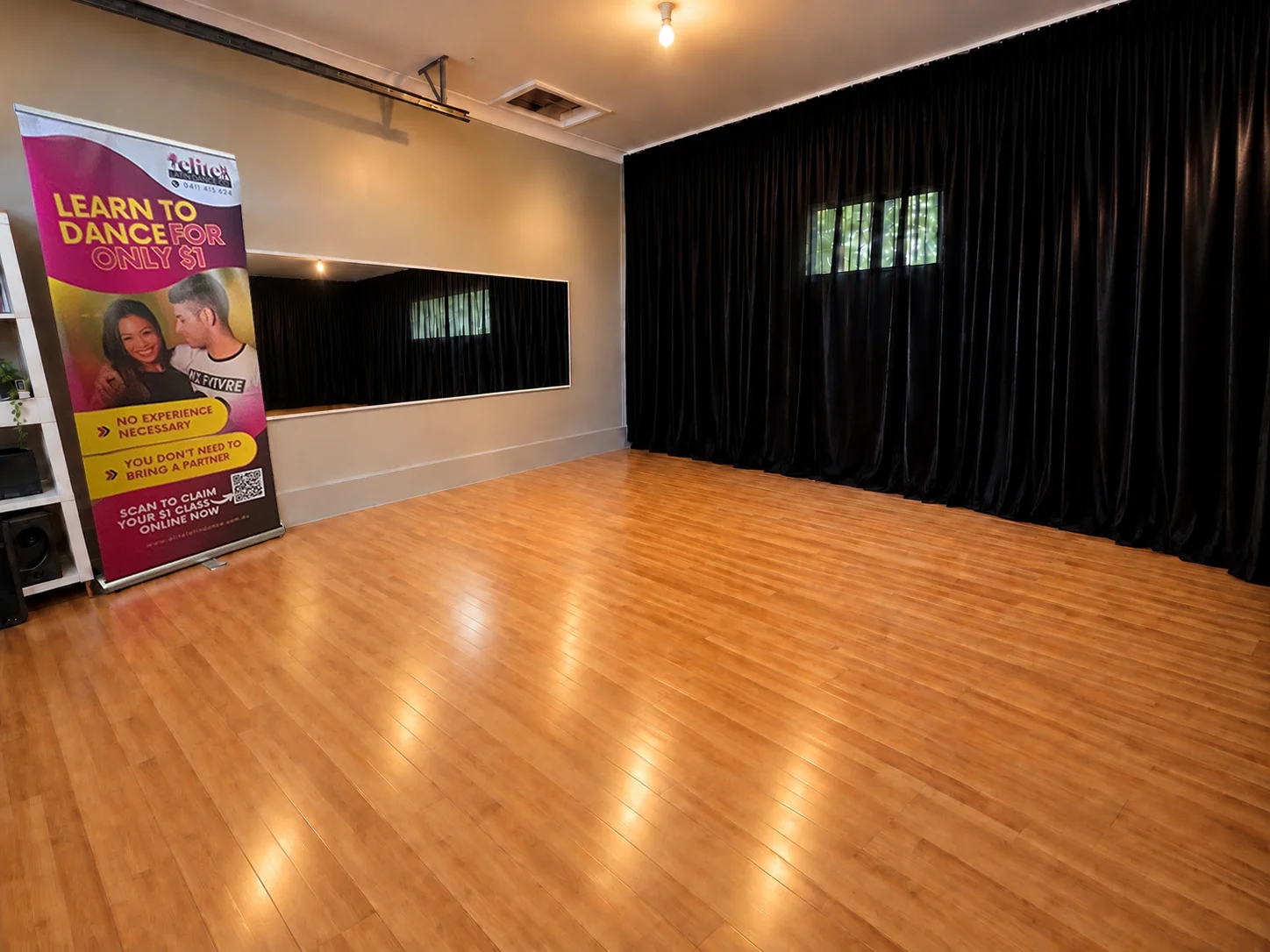 Molendinar private Latin dance studio with timber floor and wall mirror